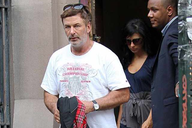Alec Baldwin, followed by fiancee Hillaria Thomas, leaves Old St. Patrick's Cathedral